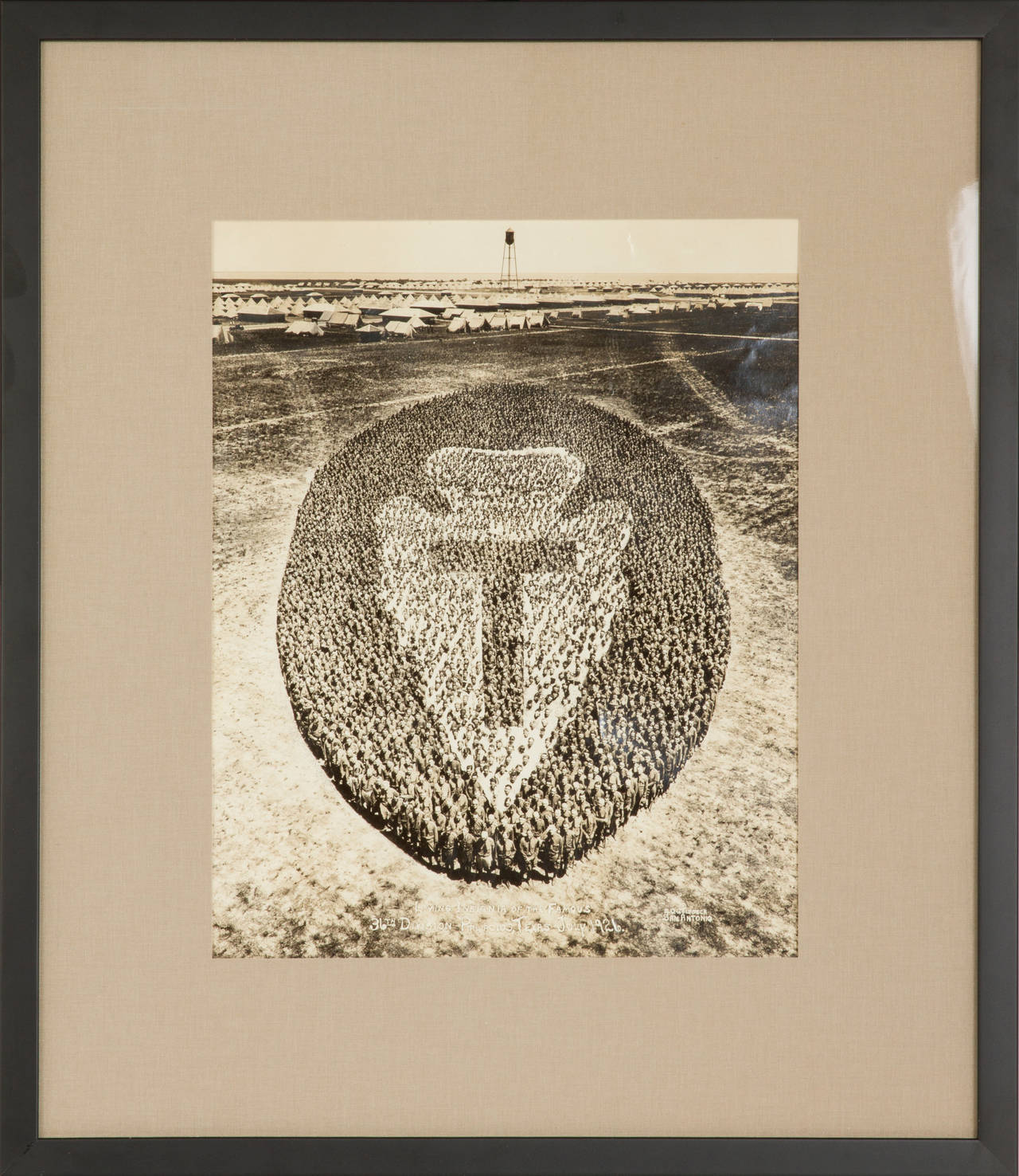 This is a wonderful example of Goldbeck's work with the military. Utilizing large amounts of soldiers in his photos, he created unusual designs. The print measuring 11" by 14", is dated July 1926 and signed Photographed by E.Q. Goldbeck of