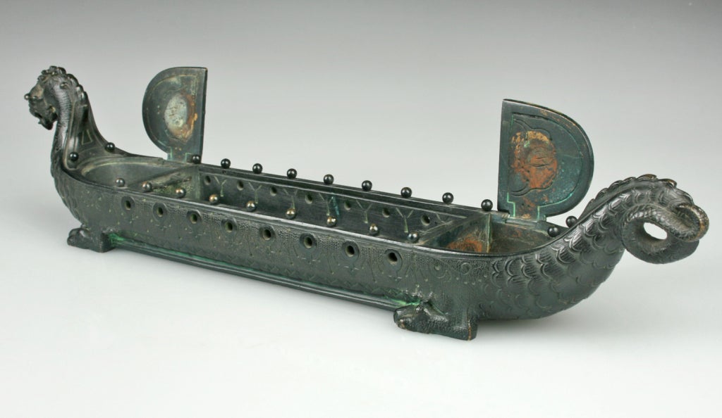 This is a beautifully detailed pen or brush holder from 1890-1910.