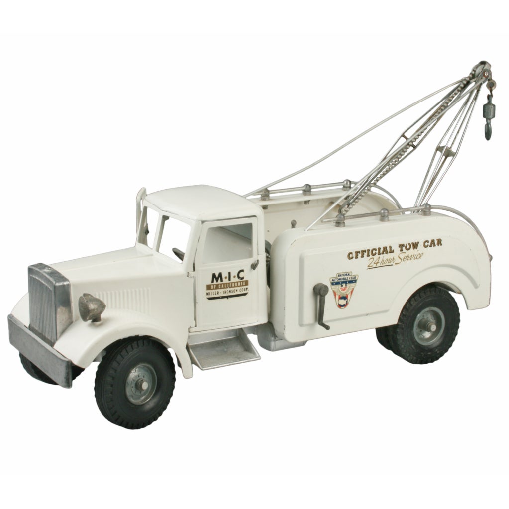 White steel Tow Truck Issued by the National Automobile Club. Decal reads Miller-Ironson-Corp. Steering wheel turns the front tires. Both doors open and winch works. Marked on the bottom SB-408., also with a Letter A circled.