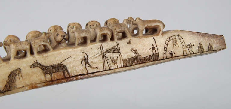 Here is a fine and exceptional Inuit Eskimo Carving from the 19th Century of Polar Bears and Walrus on the top....26 in all. There is  inscribed scratchwork carving on both the sides of the whale boneh as well as the bottom of the piece describing