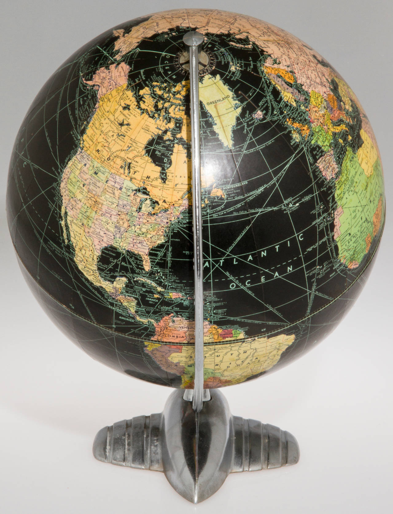 Vintage Black Ocean Globe with Machine Age Art Deco Airplane Base In Excellent Condition In Chicago, IL