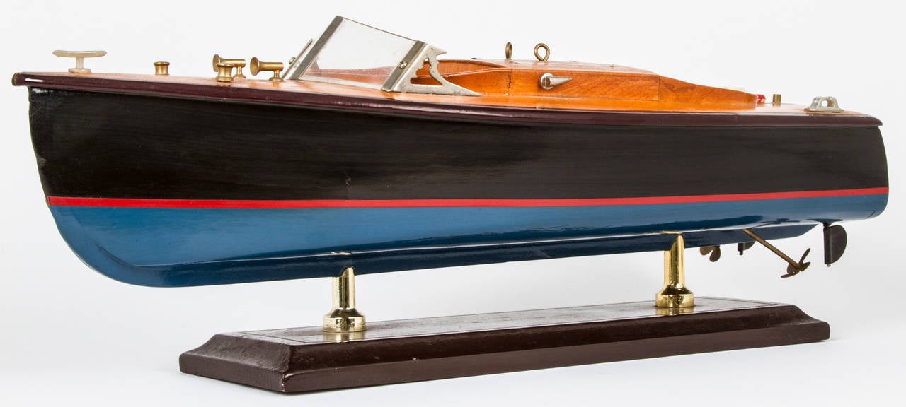 This is a nice wooden model of a motor boat similar to Criss Craft.