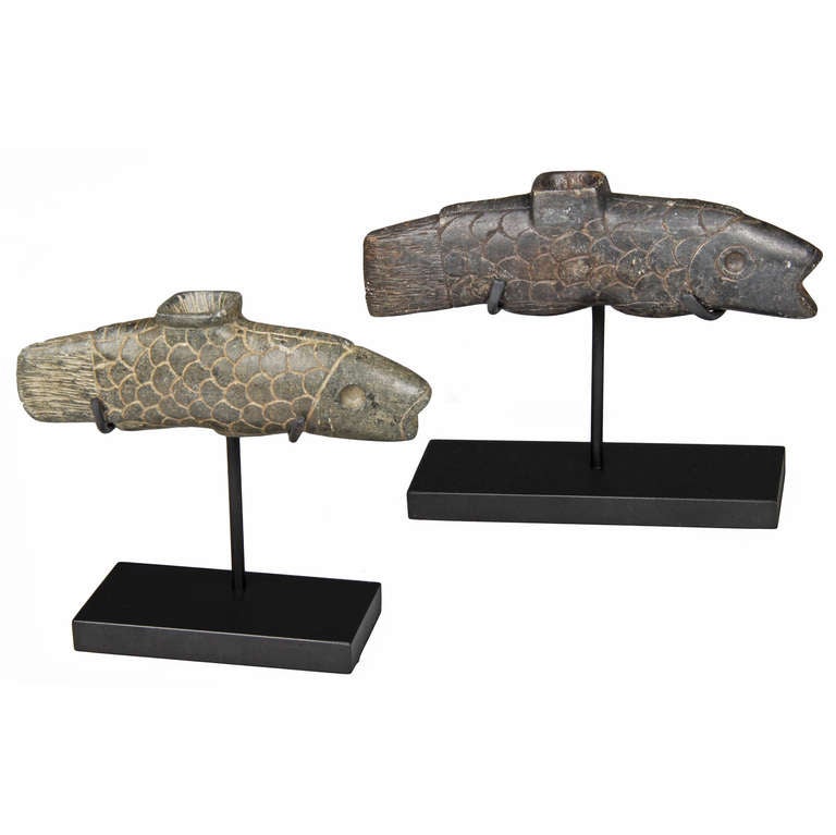 These are sculptural  and hand carved pipes.  The  larger fish measures 7 inches in length x 1 inch. The smaller fish measures 6 inches in length by one inch.
Each measures 5.25 inches tall on its museum stand.