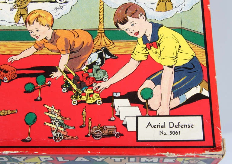 This is a fabulous boxed Tootsie Toy set.  It contains airplanes and search lights and guns  on  trucks with soldiers.  The graphics on the box are excellent.