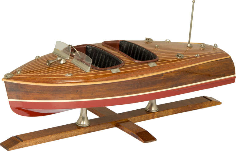 This is an accurate toy model in very nice condition of a Hacker-Craft  Double Cockpit Motor boat.