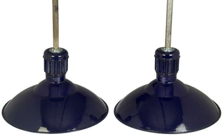 These lights were used by The Iron River Mine in Michigan. They are cobalt blue with white enameled interiors.  These are unusual because of the  vented fitting at the top. There are two pairs available.