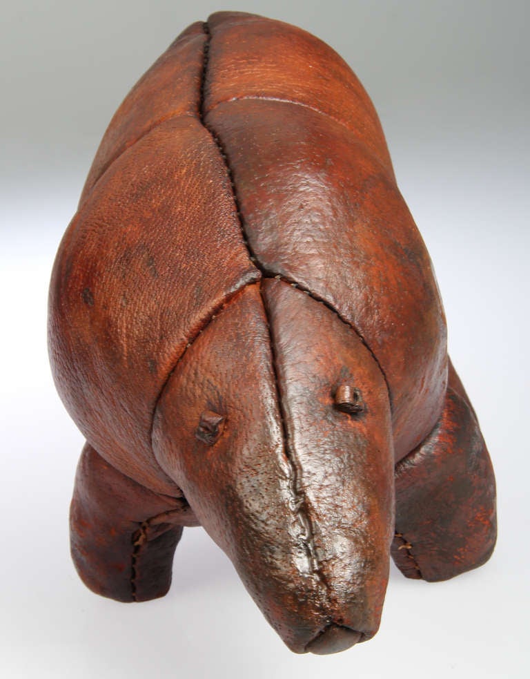 This is an older and unusual  sculptural leather Aardvark ottoman.