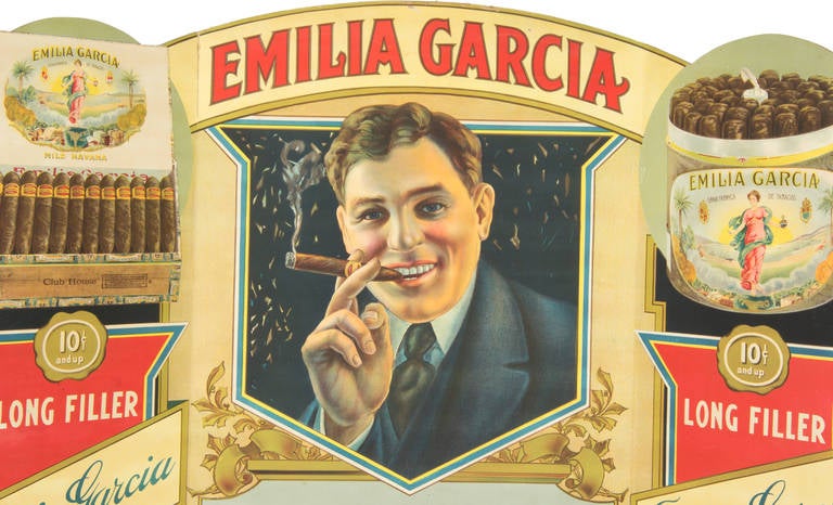 This is a vibrantly colored die cut advertisement promoting the Emilia Garcia Cigars.

It was printed by the Industrial Litho Company Inc. of Brooklyn, New York.