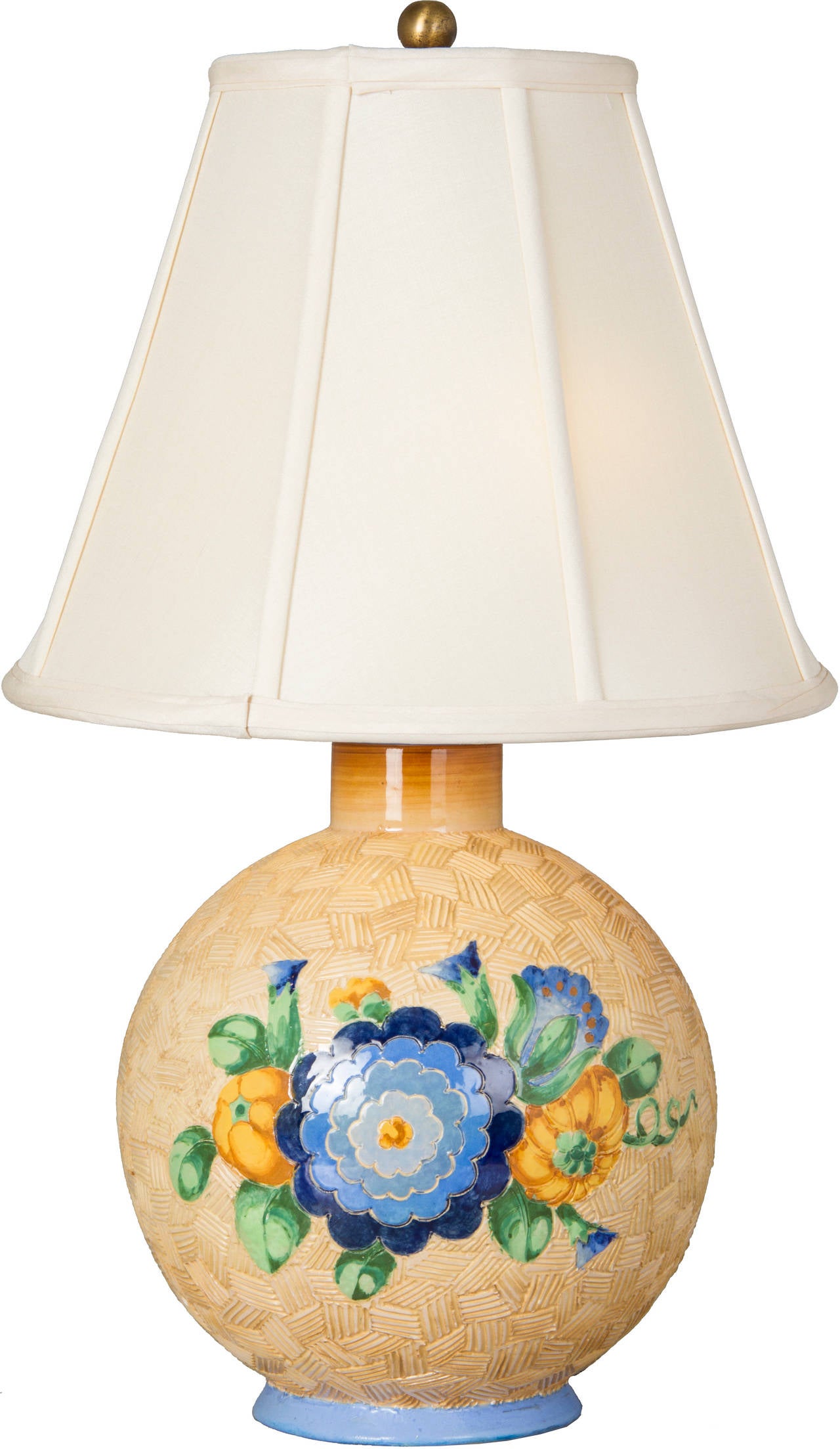 This lamp has an overall textural design and is decorated with a floral motif.