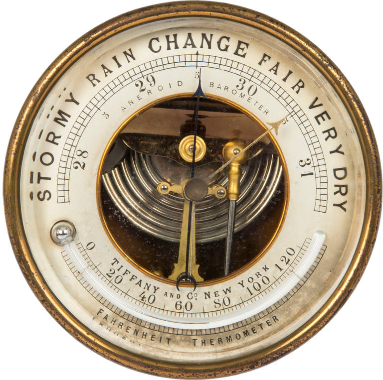 This is an unusual ship's aneroid  barometer and thermometer.
Made by Tiffany & Co. New York.