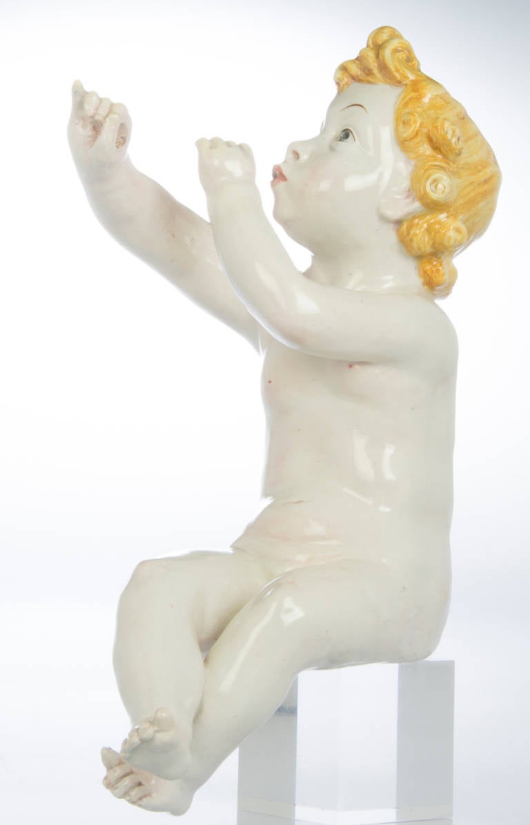 This is a whimsical and endearing sculpture. Nicely rendered, this piece has a removable tin horn that measures 11 1/4