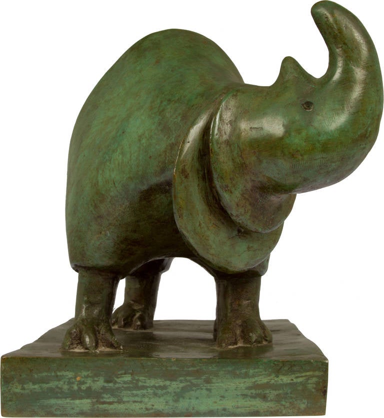 This is an abstracted small  bronze sculpture of a rhino by artist Joe McDonnell.  McDonnell creates the majority of his sculptures for public spaces and has an extensive list of installations  as well as exhibitions.