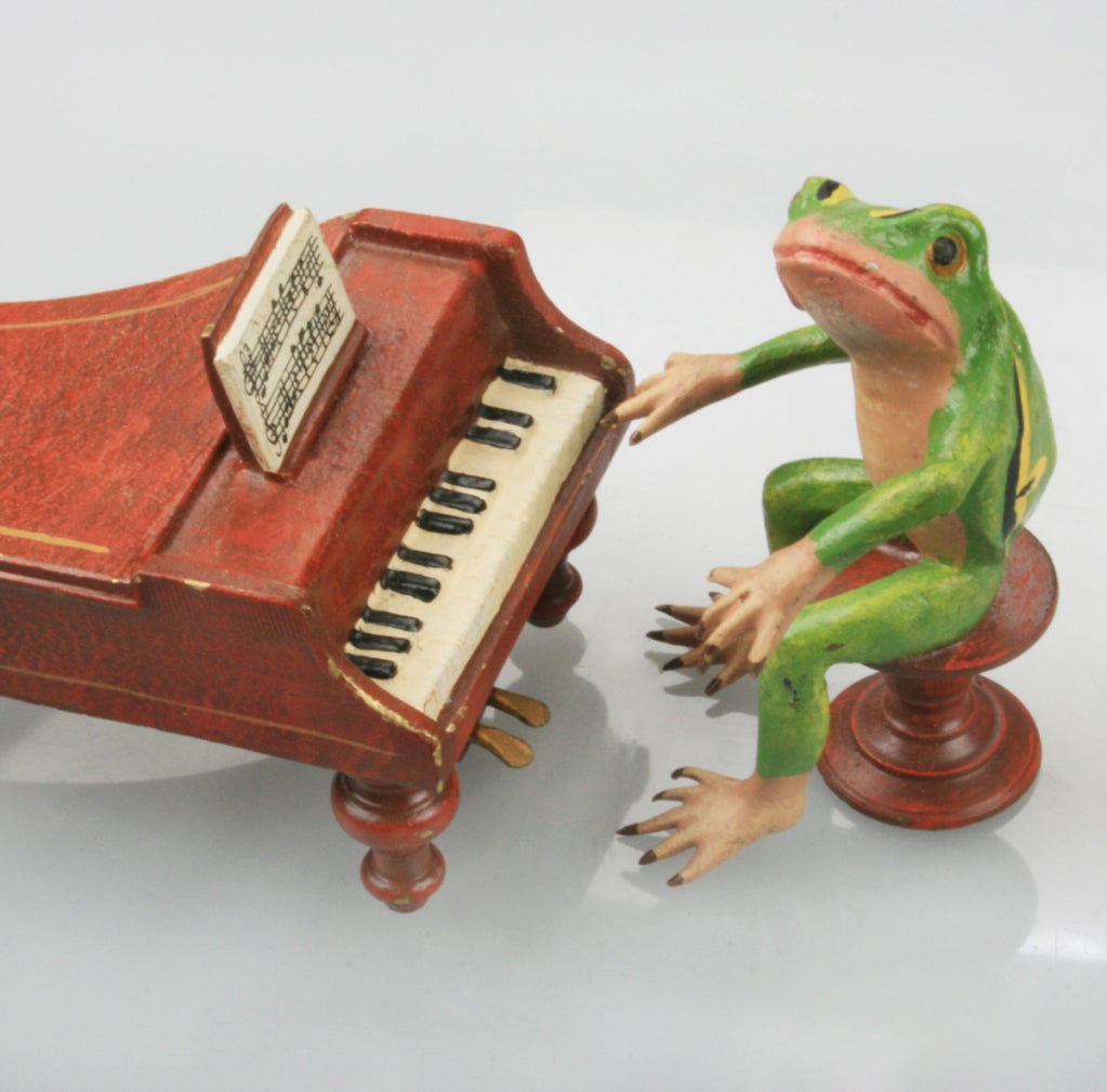 This band of Austrian frogs are cold painted bronze painted in accurate detail. The piano measures 3 1/4 