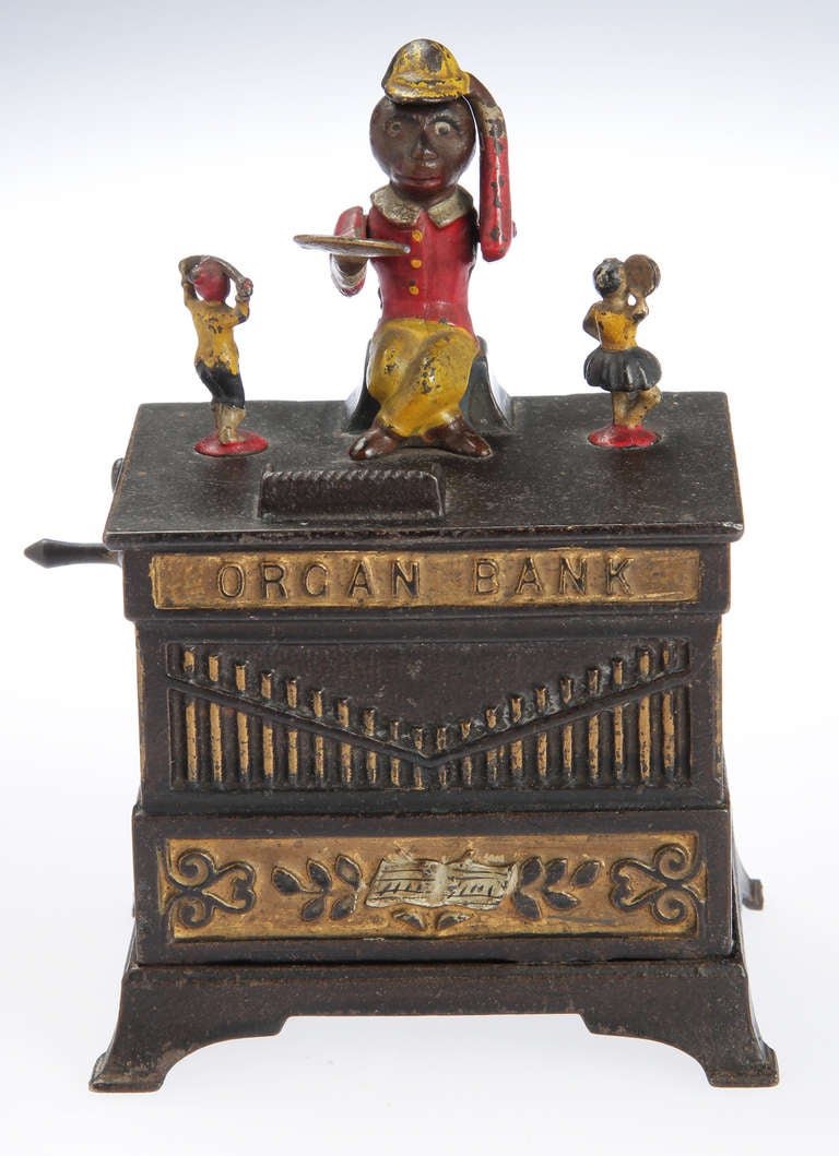 This is a Mechanical Bank  made by Kayser & Rex. When you turn the handle bells go off, the monkey turns and the figures go around in a circle. 
The key  is included.