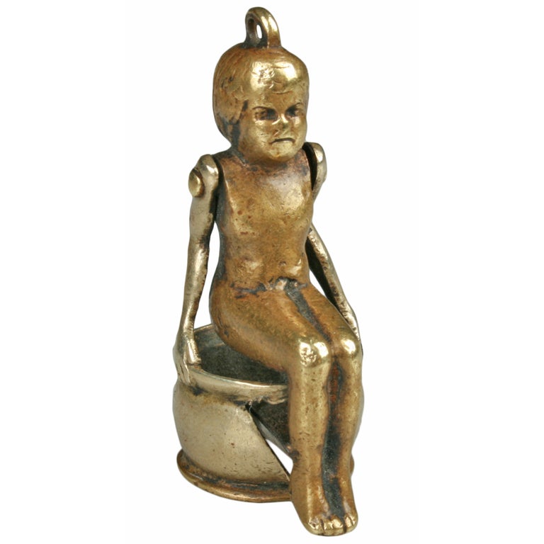 Vintage Figural Cigar Cutter Child on Chamber Pot For Sale at 1stDibs
