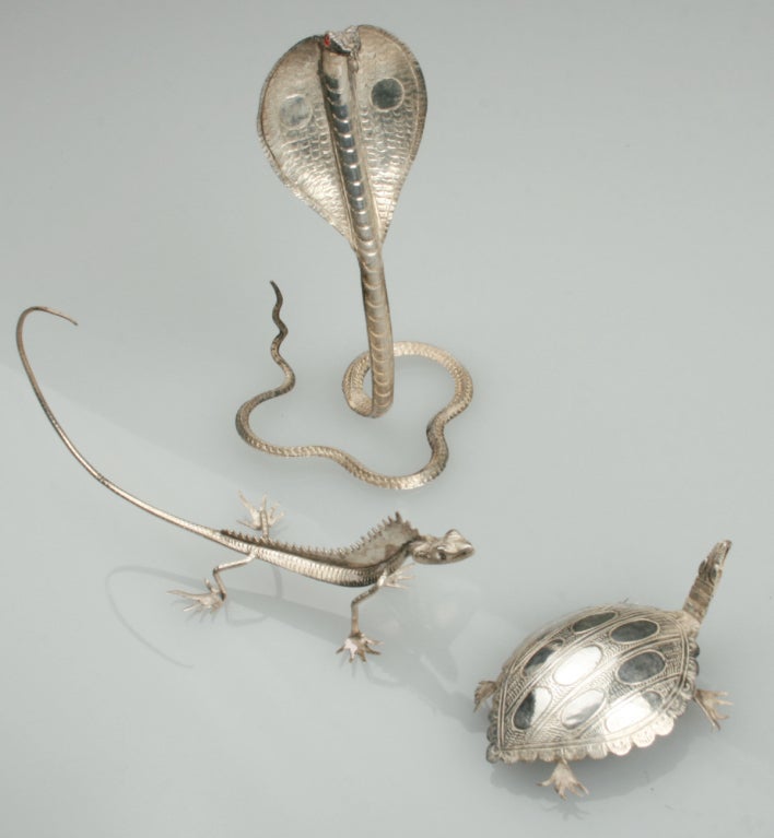 This collection of insects and reptiles are nicley detailed and are something unusual for the table or simply as a collection.  The largest measures 3 1/2 