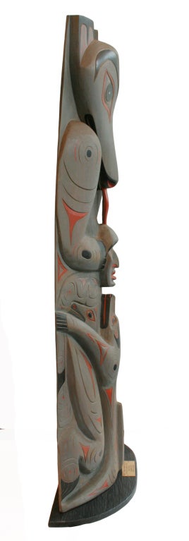 This is a fabulous statement making hand carved Totem pole from the British Columbia Coast Salish Nation Artist, Floyd Joseph-Tyee. The signature is carved into the back.
