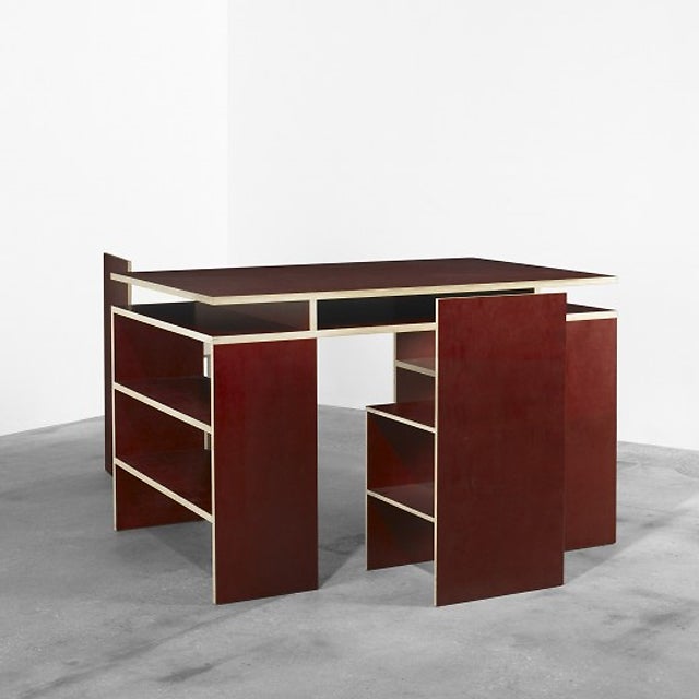 Desk and two chairs by artist Donald Judd.
Desk: 30 x 48 x 36 inches.
Each chair: 30 x 15 x 15 inches.
Stamped:  