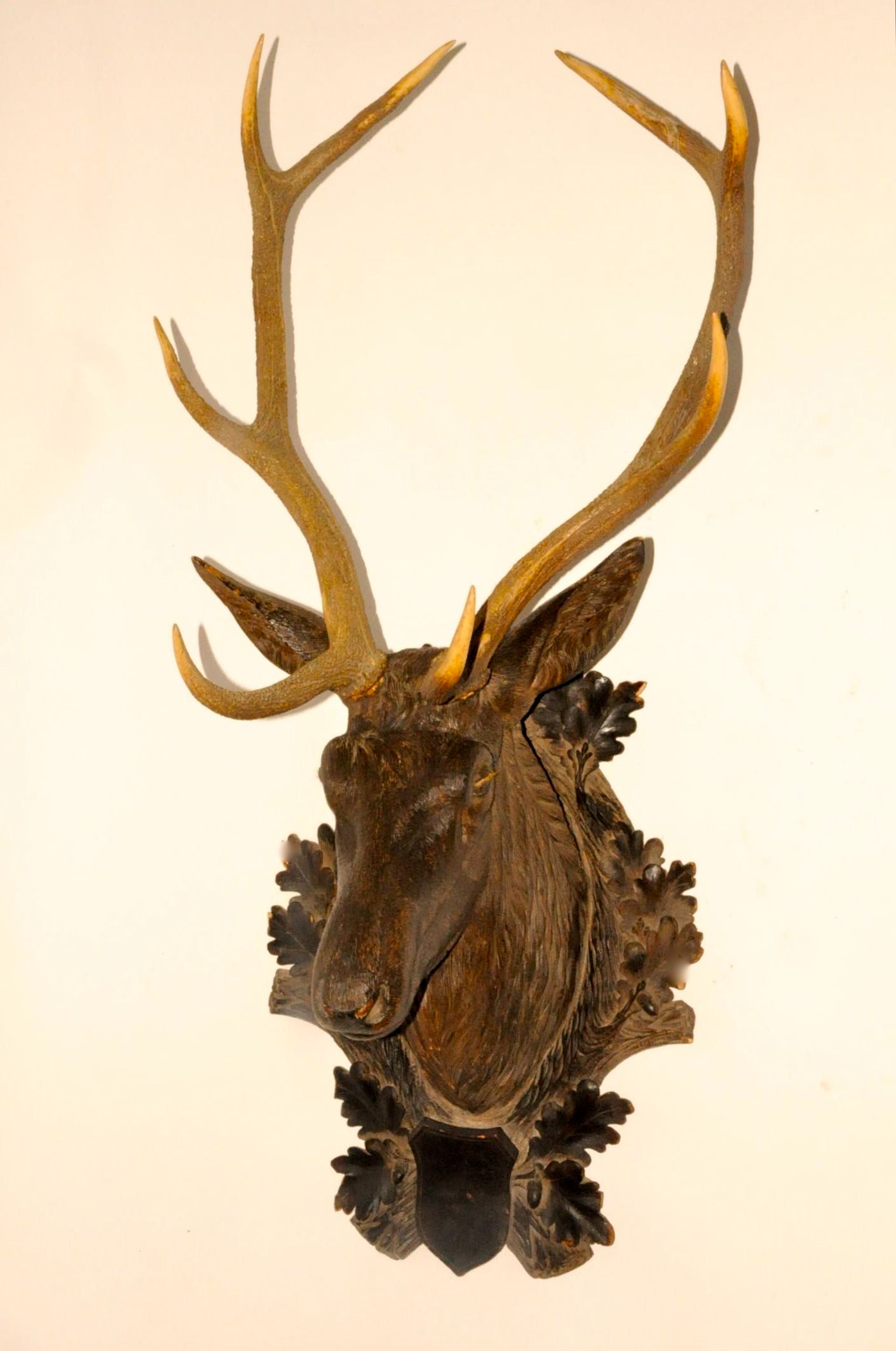 Black forest carved wood deer .