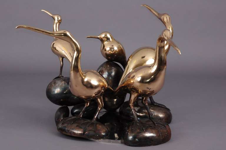 Table à manger sculpturale en forme d'oiseau de René Broissand . 
8-10 personnes 
Métal en laiton et verre.