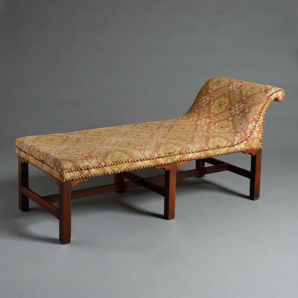 a George III Scottish mahogany daybed with original close-nailed needlework, circa 1760.