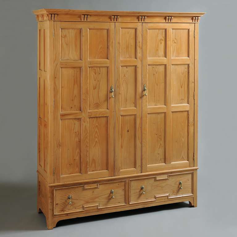 A FINE ARTS & CRAFTS CEDAR WARDROBE, CIRCA 1910.

Labelled; MADE FOR GEORGE H. WHITEHEAD FROM A CEDAR TREE FELLED AT WILMINGTON HALL DECEMBER 1909 and COOPER & HOLT, MANUFACTURERS, BUNHILL ROW, LONDON
