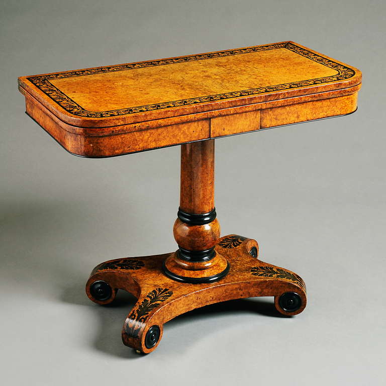A FINE REGENCY AMBOYNA AND EBONY MARQUETRY CARD TABLE ATTRIBUTED TO GEORGE BULLOCK, Circa 1815.