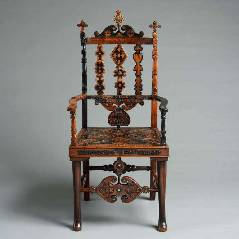 ‘THE WRECK OF NOAH’S FLOOD’

A REMARKABLE SCOTTISH PROVINCIAL BOG-OAK AND BOG YEW ARMCHAIR, MID 19TH CENTURY. 
Inlaid with various symbols and with horn, metal and a moonstone and profusely carved with text, the principle part of which reads: