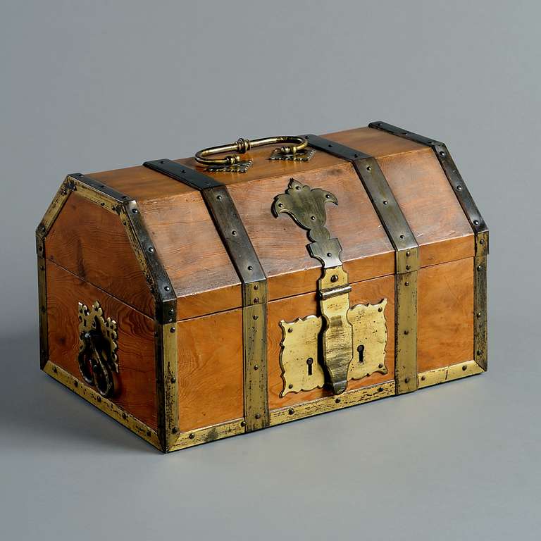A FINE VICTORIAN BRASS-MOUNTED CEDAR CASKET, THE DESIGN ATTRIBUTED TO EDWARD WELBY PUGIN, THE MOUNTS BY HARDMAN & CO., CIRCA 1856.
Labelled: 'Cedar of Lebanon Brought Home by Victoria Welby 1856.'