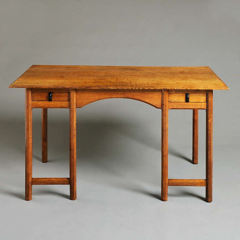 A FINE ARTS & CRAFTS OAK WRITING-TABLE BY GORDON RUSSELL, 1925.
The two cedar-lined drawers with carved ebony handles. 
Labelled: This piece, an Oak Writing Desk No. 222 was designed and made throughout in the Russell Workshops, Broadway,