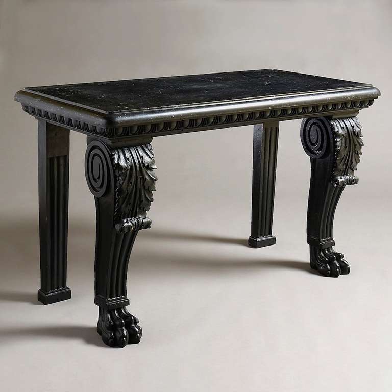 A massive irish blackpainted side table with original kilkenny marble slab and original painted decoration, circa 1830.