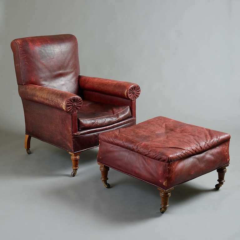 A FINE LATE VICTORIAN RED LEATHER ARMCHAIR, WITH MATCHING STOOL, ORIGINAL LEATHER IN VERY GOOD CONDITION, circa 1900.