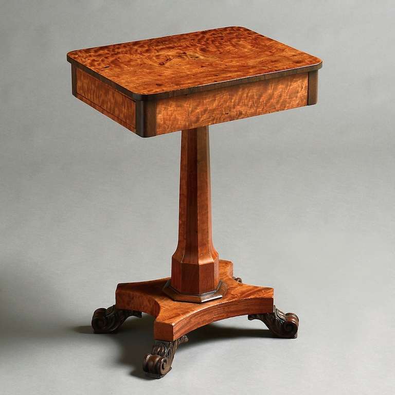 an unusual Regency satinwood and mulberry pedestal lamp table, circa 1820.
The frieze with a single mahogany-lined drawer.