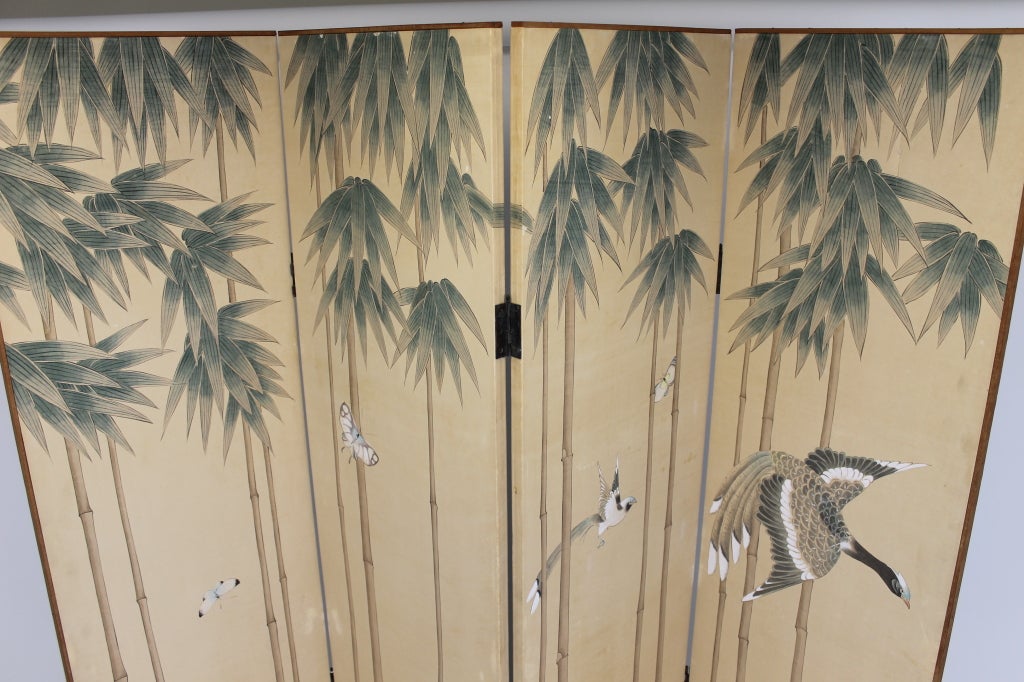 Mid 20th century Japanese screen. Hand painted silk on wood panels. Back side is covered with Japanese paper.