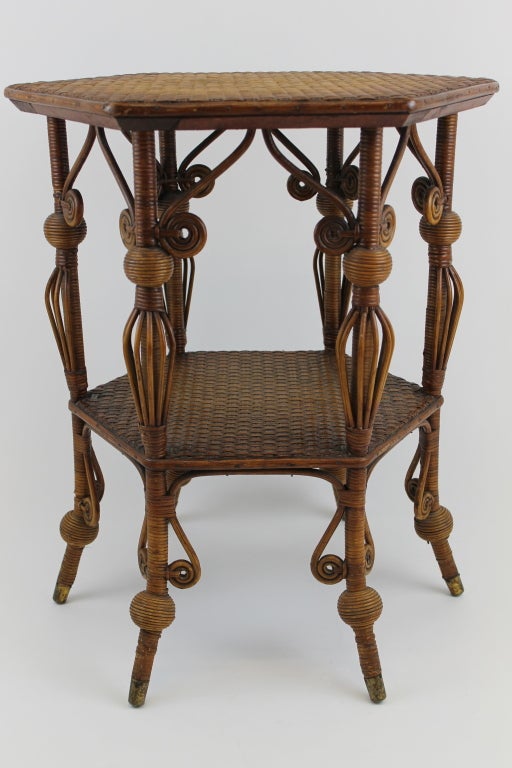 This Victorian wicker table is a beautiful pieces that can be used indoors or outdoors. The label still somewhat intact reads Heywood Bros. which pre-dates the merger with Wakefield in 1897. The weave is very tight and legs quite sturdy for an