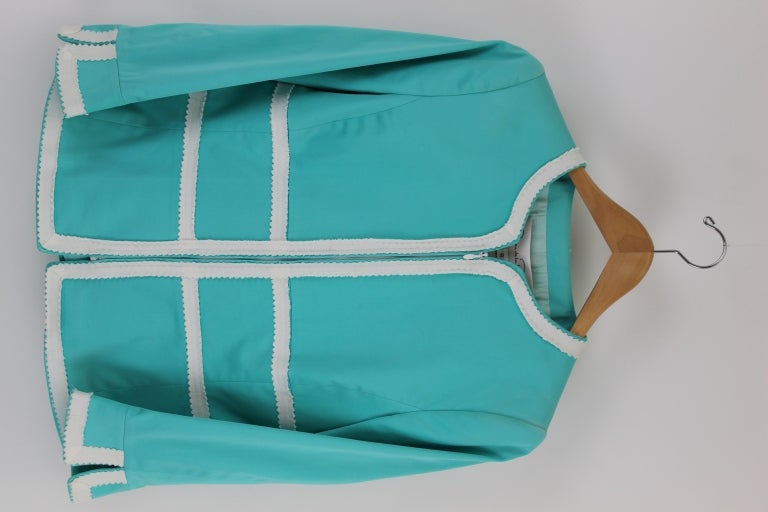 Skirt suit altered to fit Brooke Astor. The color theme looks like Tiffany packaging, very chic. Cropped jacket has cropped bracelet length sleeves. Skirt is straight fit to the knee. The Oscar De La Renta logo lining is silk. This was purchased