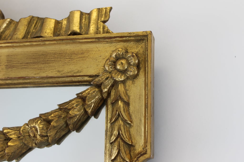 20th Century Large Italian Gilt Mirror With Ribbon and Garland Details For Sale
