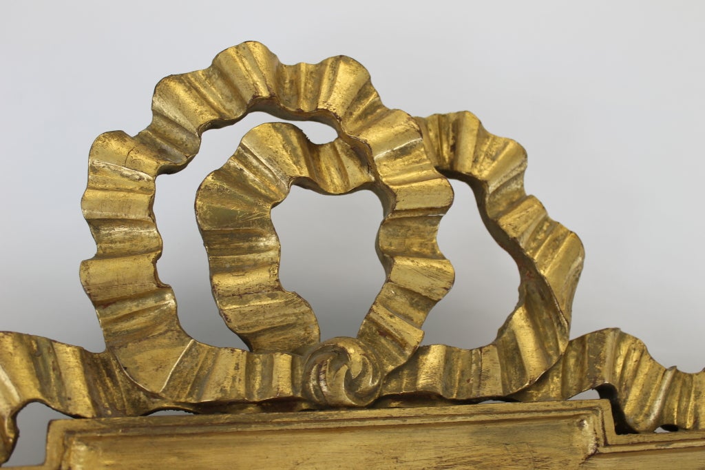 Giltwood Large Italian Gilt Mirror With Ribbon and Garland Details For Sale