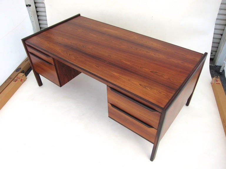 Beautiful Danish rosewood desk with four drawers.