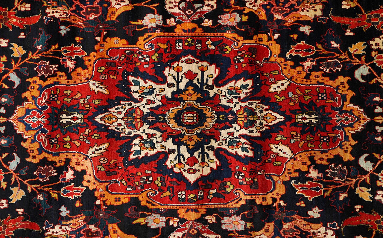 This Persian Zele Sultan Bakhtiari carpet circa 1906 consists of handspun wool and natural vegetable dyes. The inscription at the top reads, 