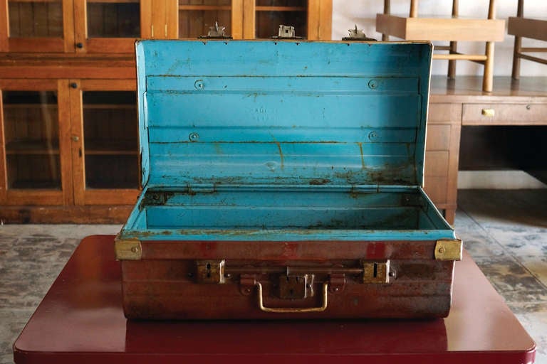 Antique steel storage trunk stamped 