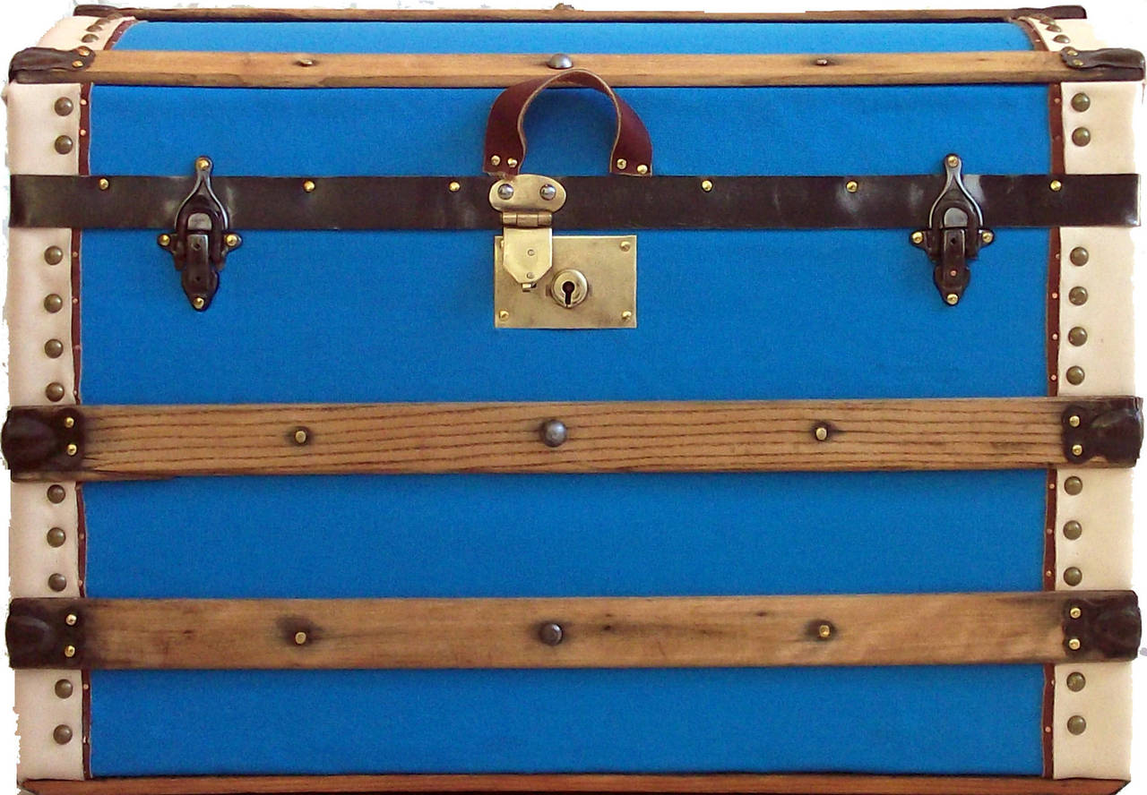 Antique ladies trunk c.1880, expertly restored by Randall Barbera Antique Trunk Restoration and Design. Features all original hardware, hardwood slats, vegetable tanned leather binding.  Solid brass hasp lock, harness leather lid lift and pair of