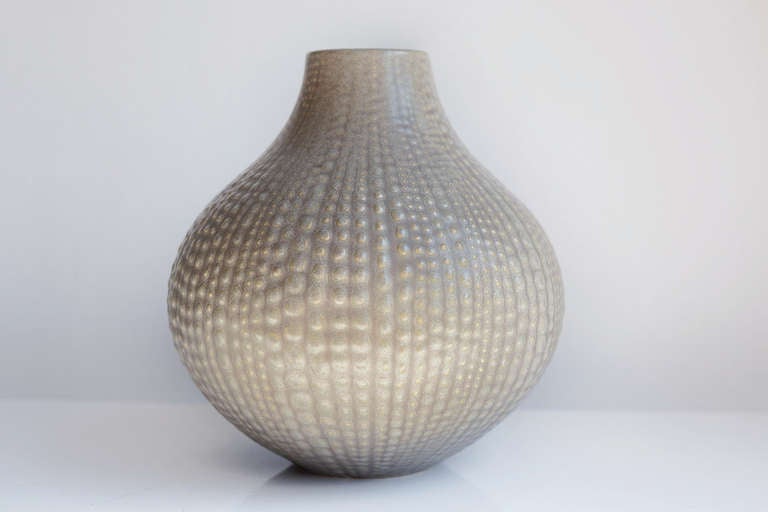 This vintage modernist-style ceramic vase by celebrated contemporary designer and ceramicist, Jonathan Adler in his classic 