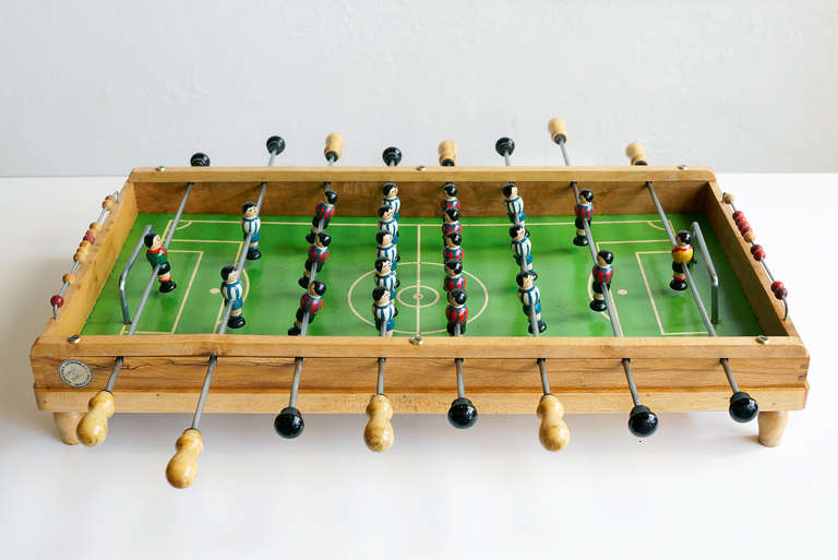 Darling foosball table toy with moving parts, c. 1950's. Handmade and painted in Spain, with original 