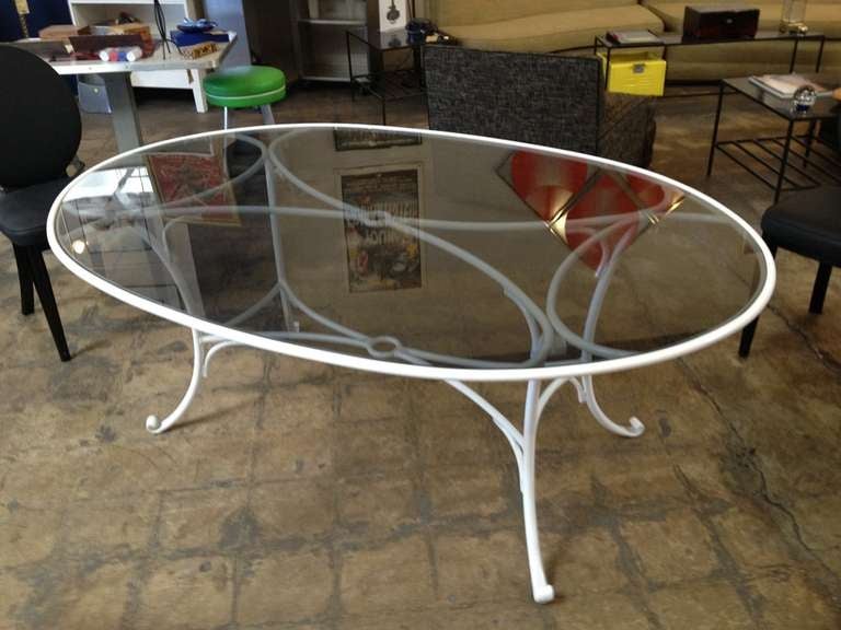 Mid-century patio dining table with smoked glass top. Frame freshly powder-coated in high gloss white. Wonderful retro 1940s/1950s look.

Dimensions: 48