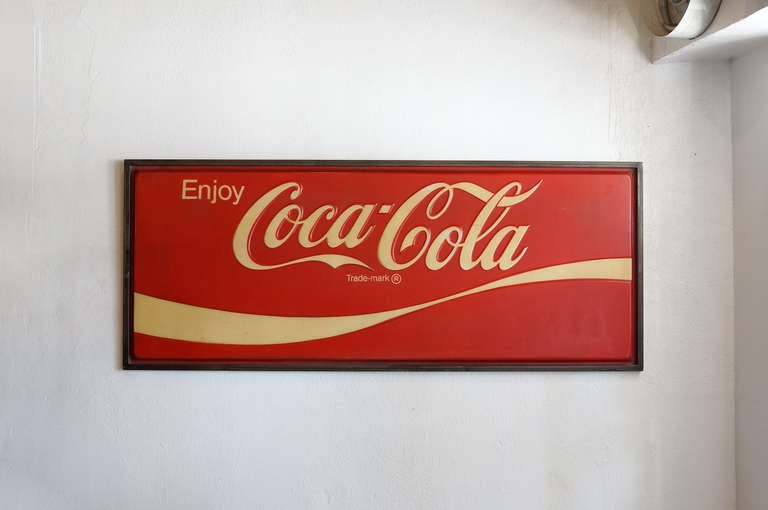 Large Coca-Cola relief sign composed of hard plastic with a custom-made welded steel frame. Super iconic with a great warm-tone vintage patina, this piece is ready to hang.

Dimensions: 85