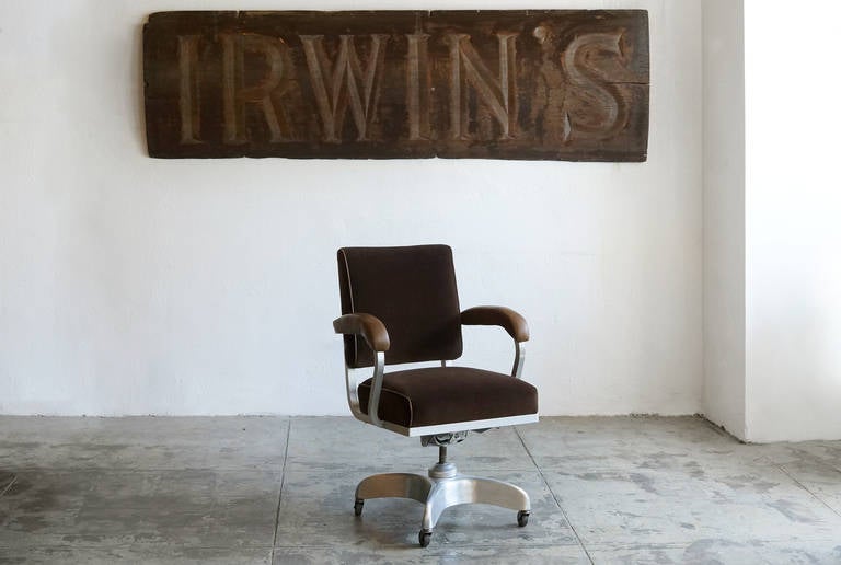 Slightly oversized with a high back, this vintage steno office chair is perfectly suited for the executive. Newly reupholstered in soft brown velvet with leather arm caps and matching leather piping. Brushed aluminum frame and hardware. Adjusts and