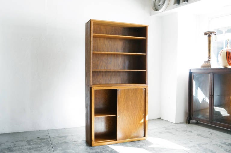 Vintage oak open bookcase cabinet on top of lower cabinet. Custom made,  this cabinet is of excellent quality and craftsmanship. Adjustable shelves above double gliding doors with locks. Lower compartment houses two adjustable shelves. 

45