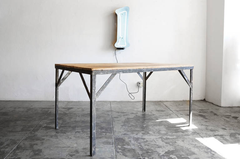 Reclaimed wood and steel work table composed of materials from a former Chinese Laundromat; makes for a killer vintage Industrial piece, circa 1940s

Dimensions: 36