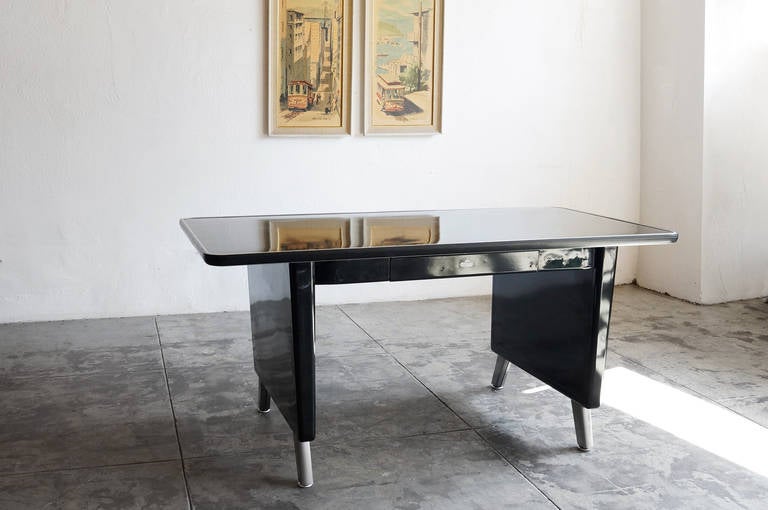 Rarely seen 1960 AllSteel panel leg tanker table with over-sized bumper Top. Beautiful sleek frame newly refinished in high gloss black. Dings on top and front apron as described in photos.